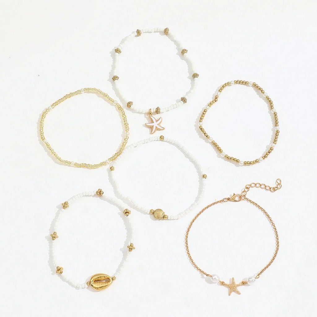 Ensemble de 6 bracelets de cheville empilables avec pendentifs en forme d'étoile de mer et coquillage, pour femme.