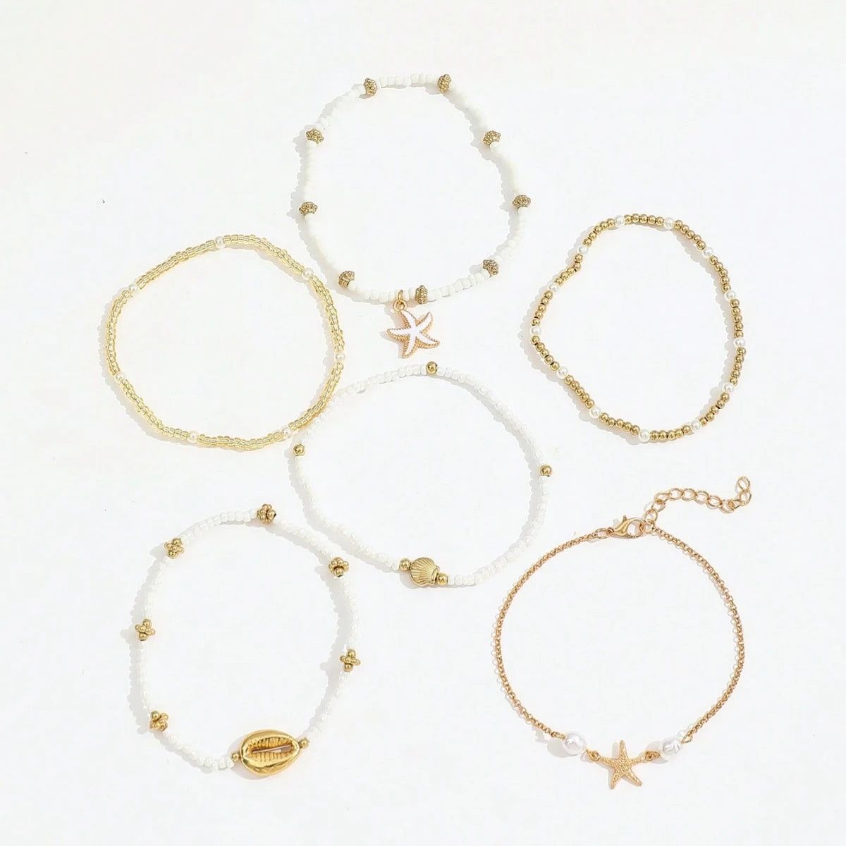 Ensemble de 6 bracelets de cheville empilables avec pendentifs en forme d'étoile de mer et coquillage, pour femme.